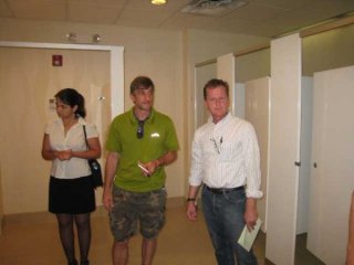 When you visit a plumbing company or plumbing showroom, checking out their own restrooms is a must. Jen Data, J.B. and Paul, with Nora taking the shot. In the men's room.